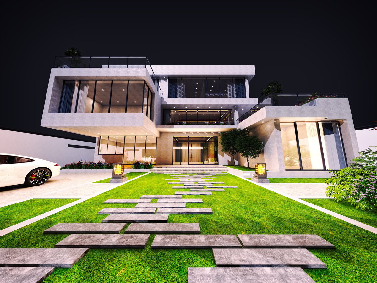 Luxury villa exterior lit up at night